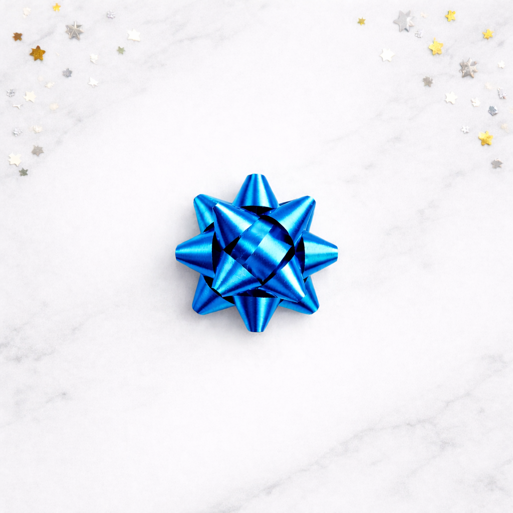 Blue gift bow on a white background with star-shaped confetti