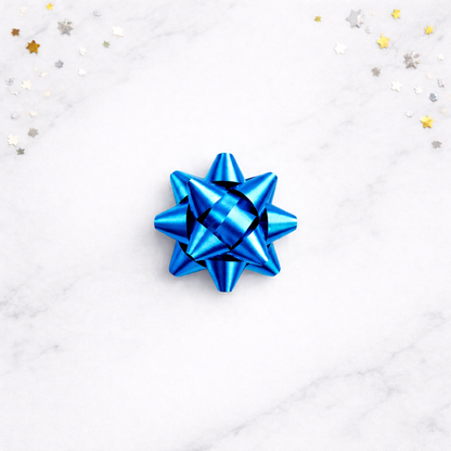 Blue gift bow on a white background with star-shaped confetti