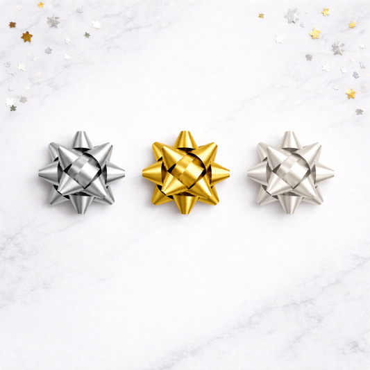 Three decorative bows, two silver and one gold, on a white background with star confetti.