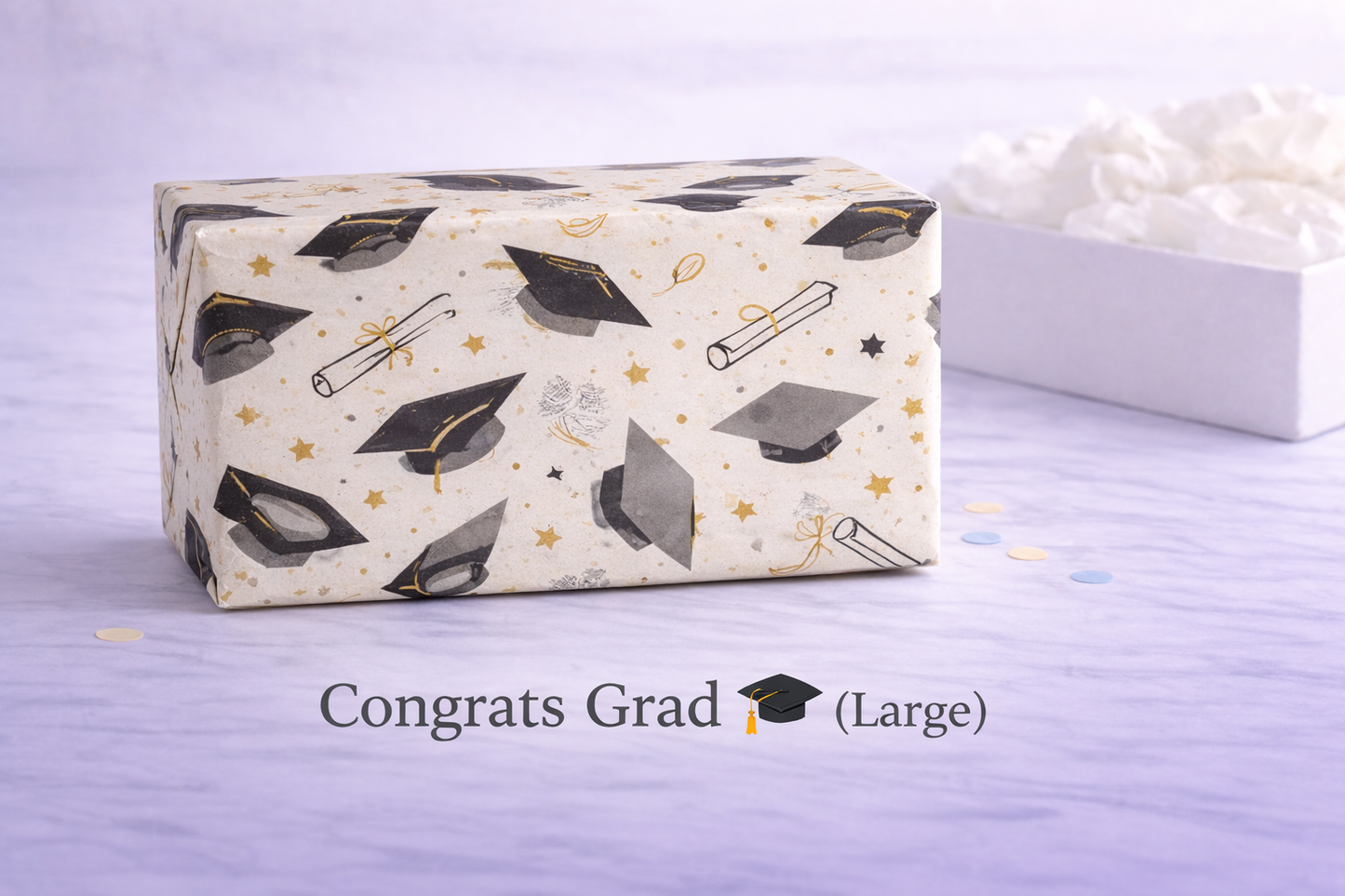 large Graduation-themed gift box with decorative patterns on a light purple background