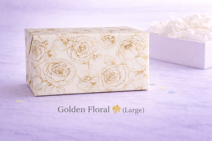 Large rectangular box with gold floral pattern on a light purple background