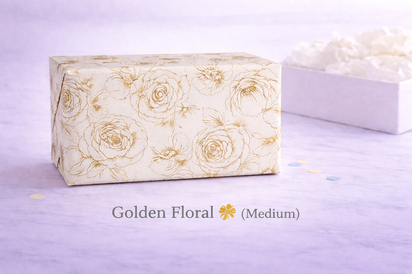 Gift box with gold floral pattern on a light purple background
