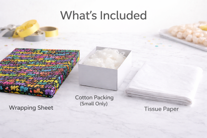 Packaging contents including a wrapping sheet, cotton packing, and tissue paper on a white surface.